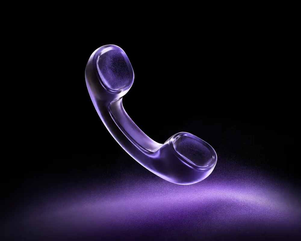 Glass phone handset glowing in the dark, representing missed calls